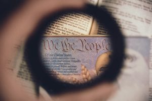 Soft focus of a magnified line from the U.S. Constitution - &ldquo;We the People.&rdquo; Image by Anthony Garand, via unsplash.com