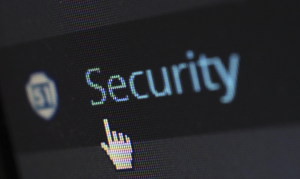 Upclose shot of computer screen with the word &ldquo;Security&rdquo; and a hand-shaped cursor; image by Pixabay, via Pexels.com.