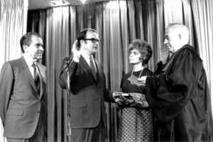 The first EPA Administrator, William D. Ruckelshaus, being sworn in with President Nixon behind him. Image via EPA.gov, public domain.