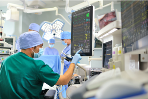 Medical staff checking patient&rsquo;s stats on monitor; image by Javier Matheu, via Unsplash.com.