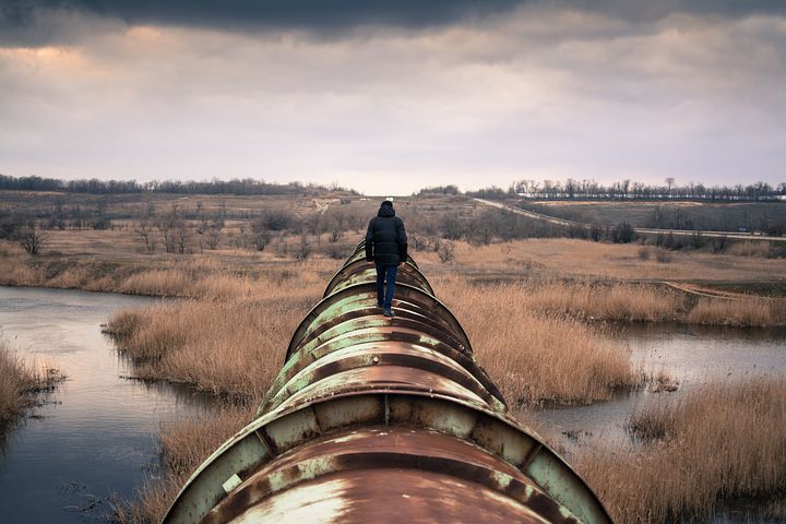 Person walking on a pipeline