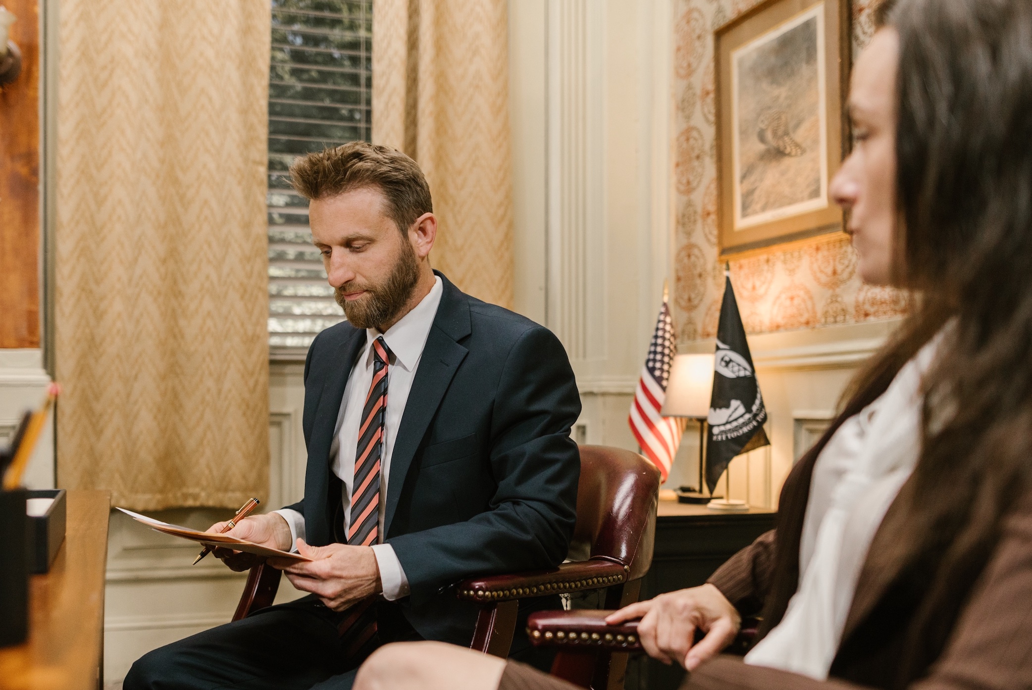 Man and woman in office; image by RODNAE Productions from Pexels.com.