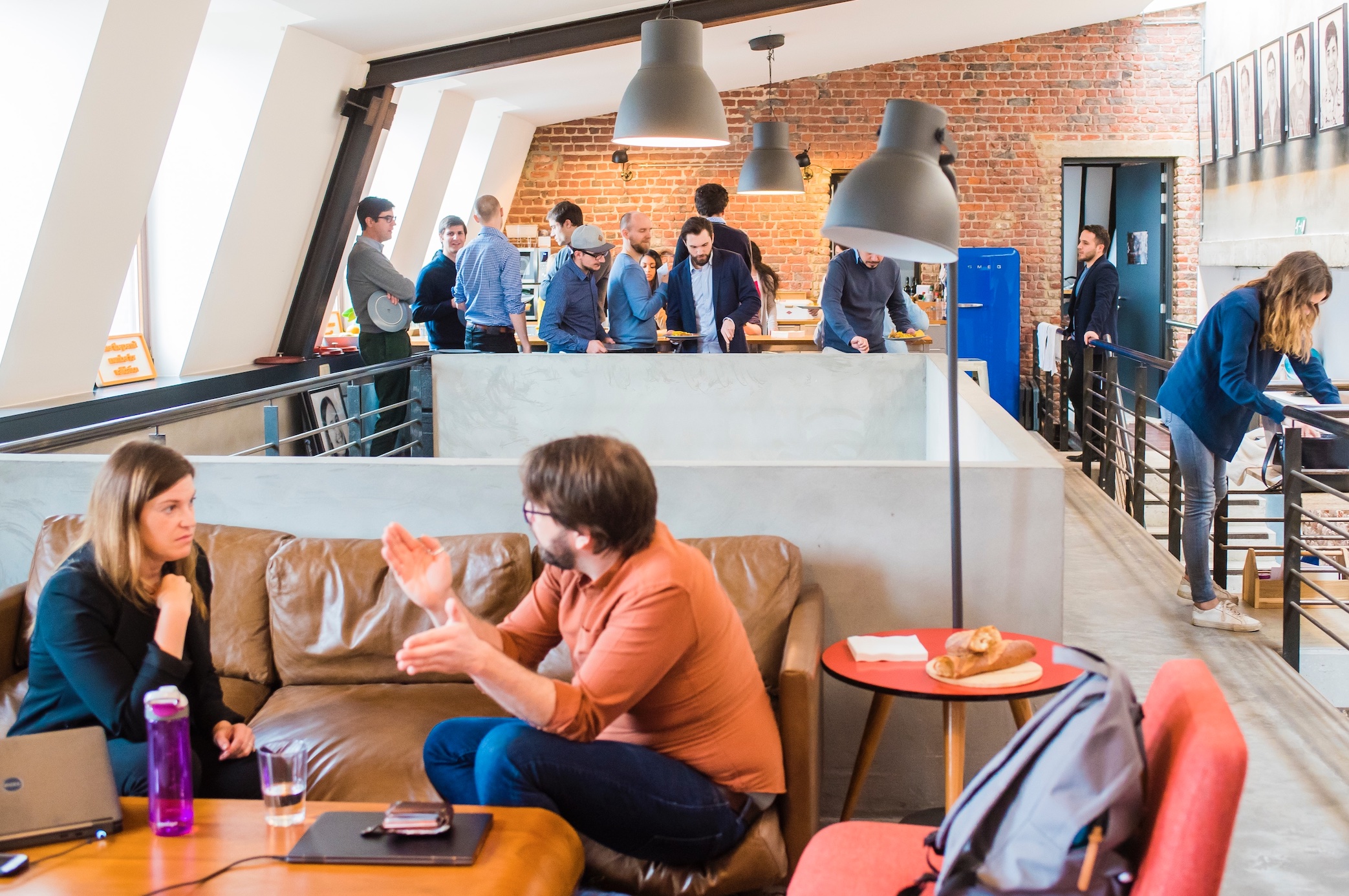 Team meetings in open plan workspace; image by Proxyclick Visitor Management System, via Unsplash.com.