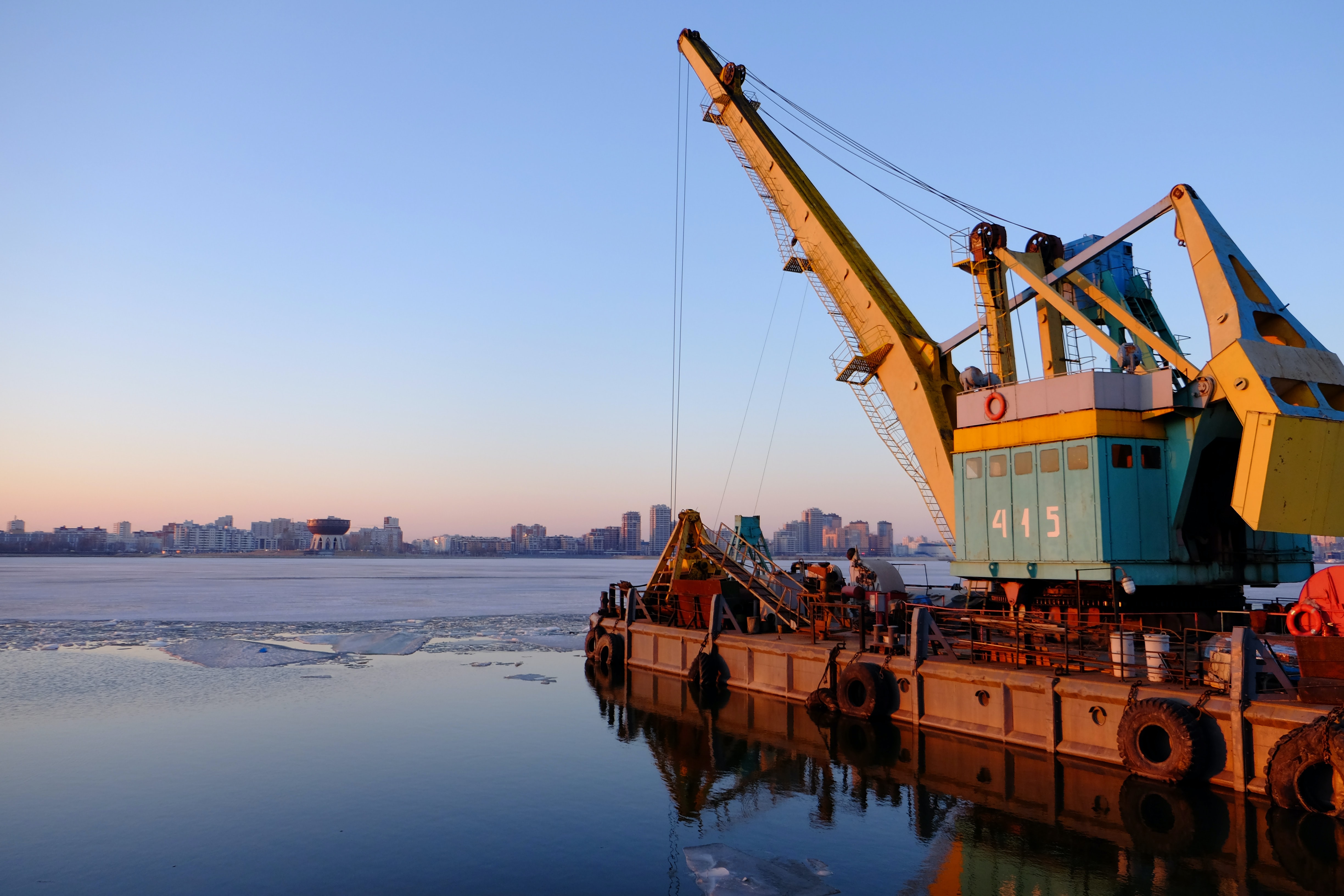 Industrial crane; image by Ksenia Kudelkina, via Unsplash.com.