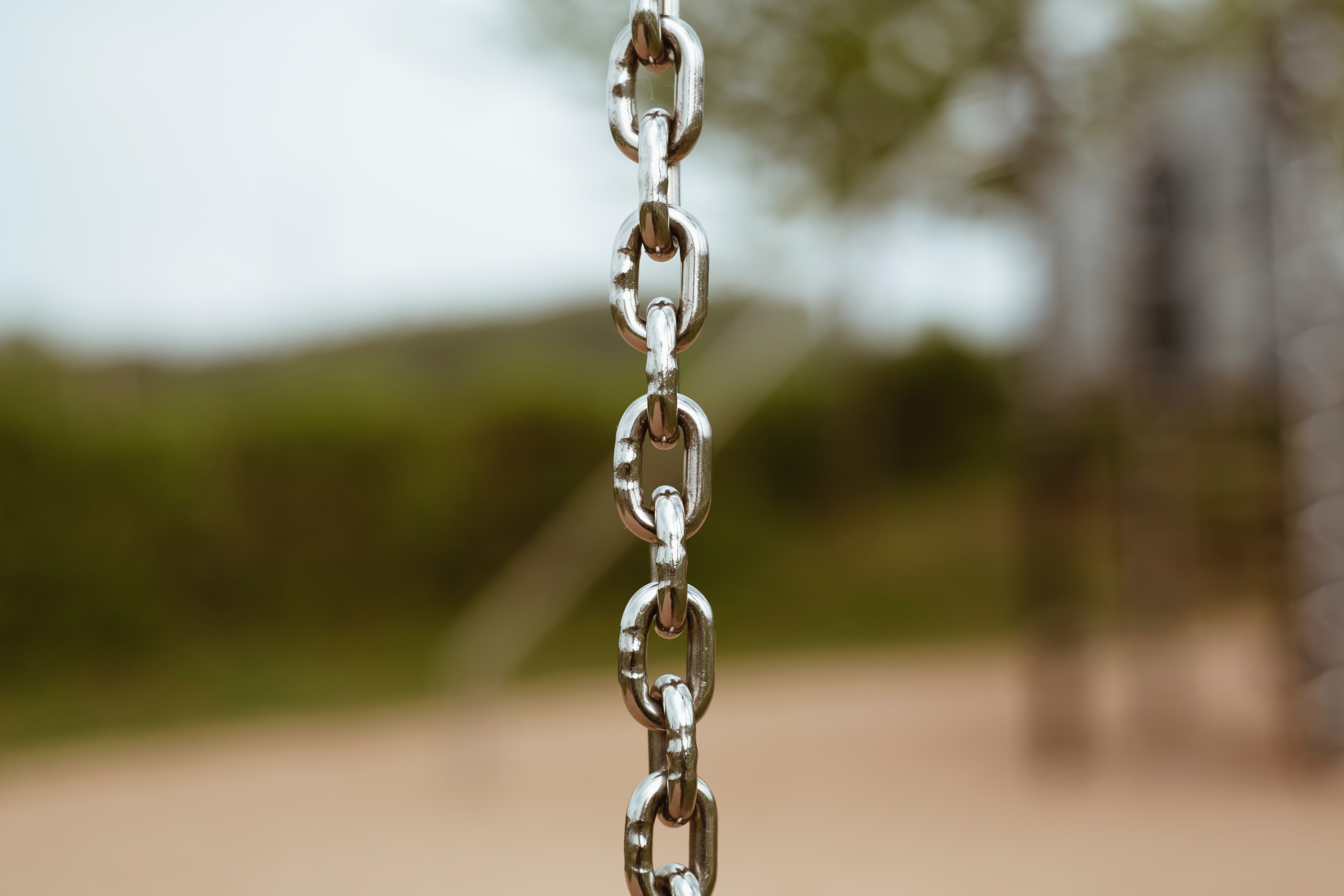 Selective focus photography of silver-colored chain; image by Markus Spiske, via Unsplash.com.