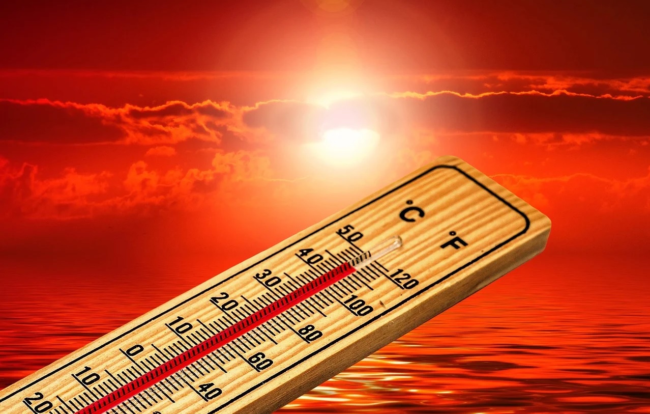 A thermometer reads 111&deg;F or 45&deg;C against the backdrop of the sun in a burning red sky.