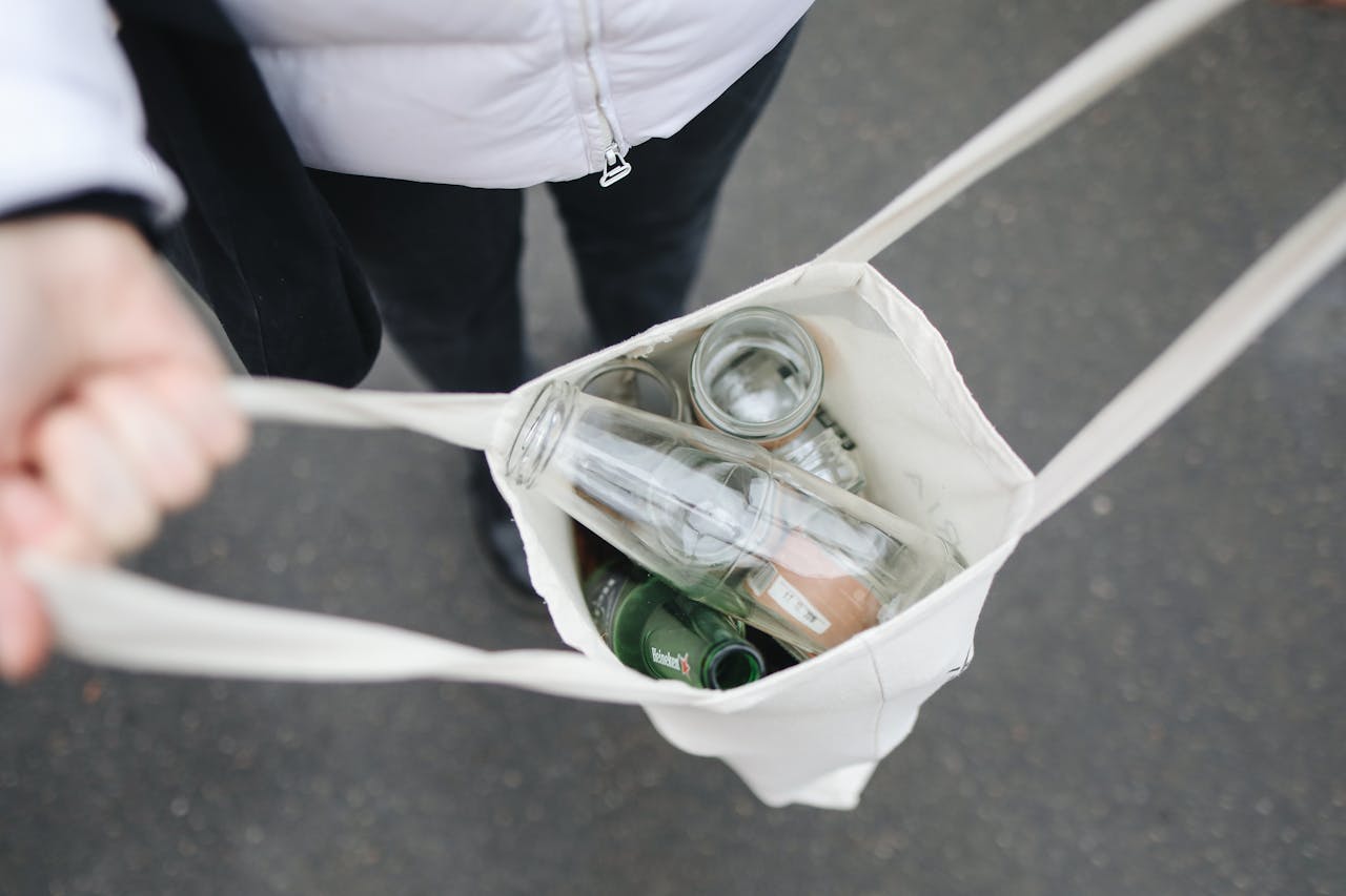 Glass bottles in bag; image by Polina Tankilevitch, via Pexels.com.